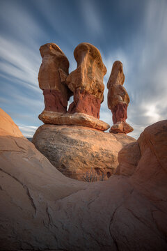 View of the unique red rock hoodoos in Devils Garden, featuring striking sandstone formations under a dramatic sky in Escalante, Utah, United States.