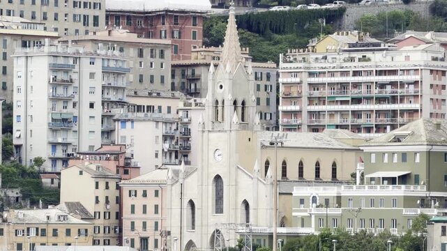 26 April 2026, Italy, Liguria, Genoa - Chiesa di San Teodoro catholic church and residential housing area on Via Venezia and holiday rentals B&Bs Terrazza su Genova Stella Maris