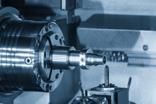 High precision parts cutting on a multi-tasking CNC machine in blue tone
