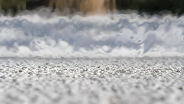 Abstract gray texture with soft rippled surface and blurred background, creating calm atmospheric pattern for neutral backdrop