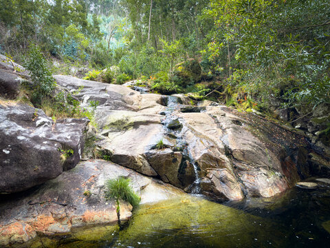 Scenic natural waterfall and river pool at Rio Ancora