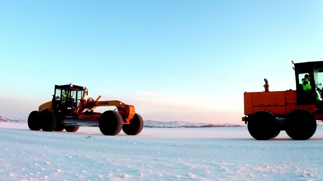 Snow Machinery Convoy Revealed Across a Frozen Landscape