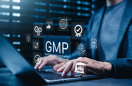 Good Manufacturing Practice (GMP) Concept. Businessman working on laptop with icons representing compliance, quality control, assurance, certification, factory standards, certified process management,