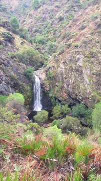 Hiking trail to waterfalls over river Caballos, Sierra de la Nieves National Park in Tolox, Malaga, Spain