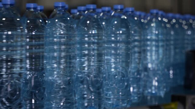 Rows of Plastic Bottled Water in Factory Production