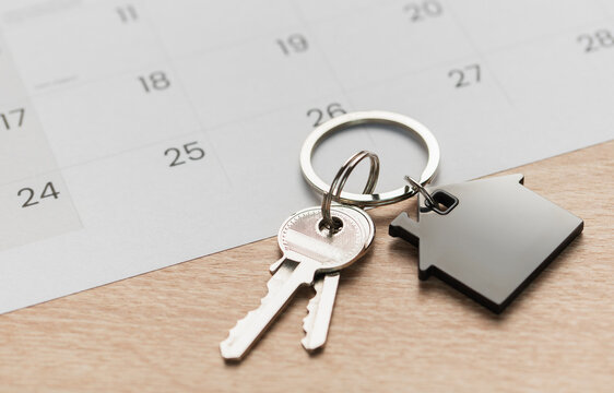 House keys with calendar background indicating moving day