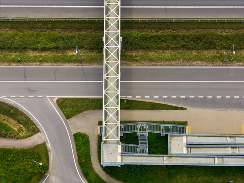 Aerial view of the pedestrian bridge spanning the highway in Ziezmariai, Kaunas County, Lithuania.