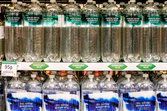 Marks And Spencer Supermarket vDisplay Of Sparkling And Still Naturally Filtered Bottled Water With Price Tag