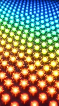 Colorful rainbow led lights glowing in a mesmerizing abstract geometric pattern with a pulsating wave effect on a grid panel