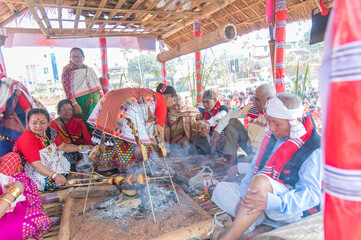 Mising elders gathered inside the traditional thatched cottage around the central hearth during the Ali-Aye-Lhigang festival in Guwahati,Assam,India on 19 february 2025. © Kulajit