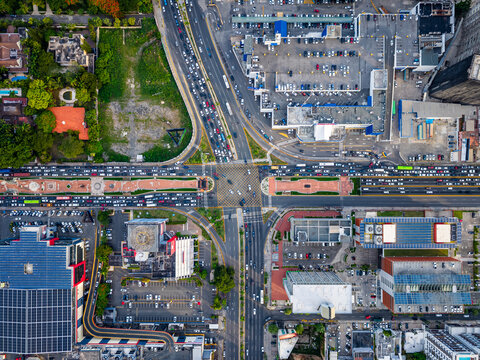 Aerial view of the intersection of Avenida 27 de Febrero and Avenida Winston Churchill with heavy traffic and urban buildings in Santo Domingo, Distrito Nacional, Dominican Republic.