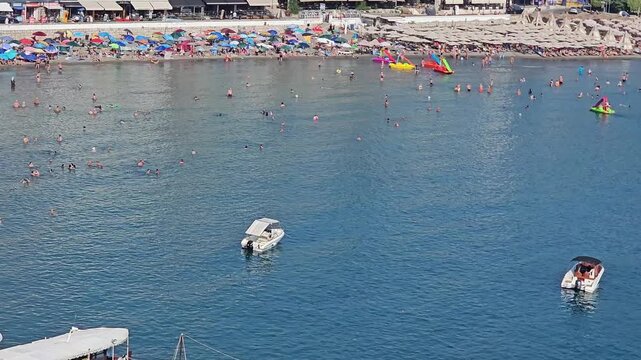 small beach in ulcinj montenegro on a sunny summer day with people in the distance video
