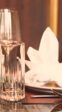 Folded napkin sits on a plate at a fine dining table in Mayfair, London