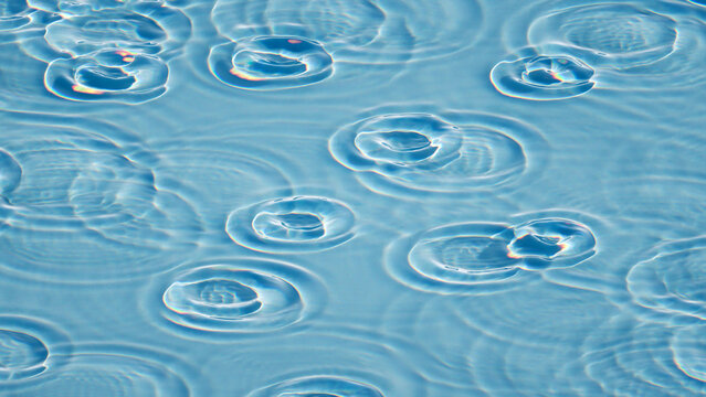 Blue water caustic pattern with soft ripples and light circles. Clean abstract texture for summer backgrounds, pools, and design.