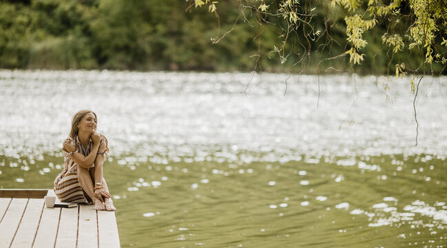 Joyful moments by the serene lakeside on a sunny afternoon