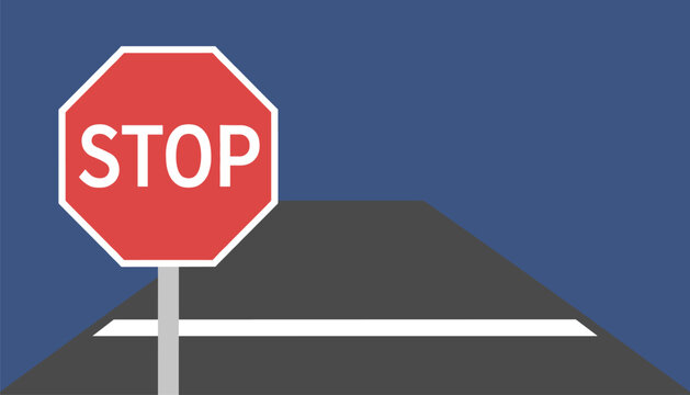 Red octagonal stop sign stands on a metal pole at the edge of a grey asphalt road with a thick white painted line.