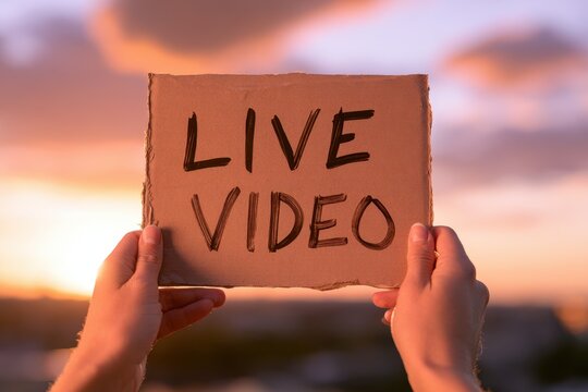Cinematic image of a sign raised during golden hour to convey online video marketing and audience engagement