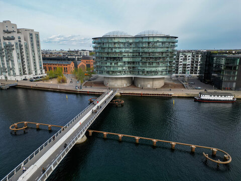 Aerial view of the Gemini Residence apartment building with its distinctive circular towers situated along the waterfront in Copenhagen, Denmark.
