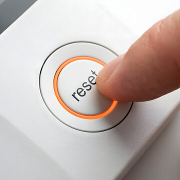 Finger Pressing Reset Button