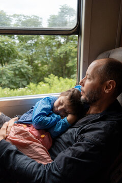 Father and Child Relaxing on Scenic Train Ride. Sri Lanka