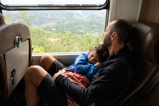 Father and Child Relaxing on Scenic Train Ride. Sri Lanka