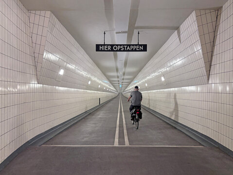 cyclist in tunnel