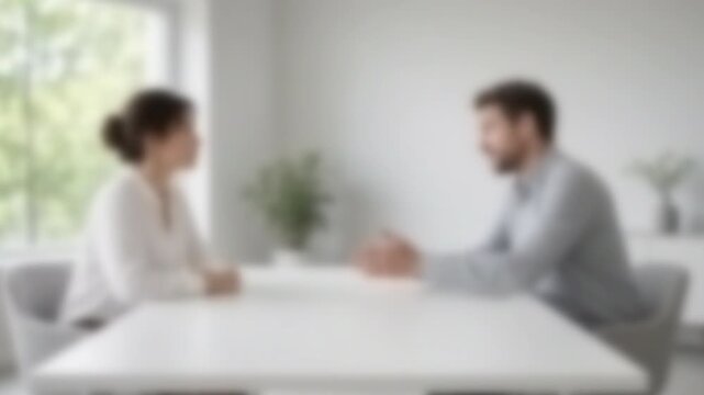 Client meeting across a white table in a daylight-filled room, Full Gaussian Blur Abstract