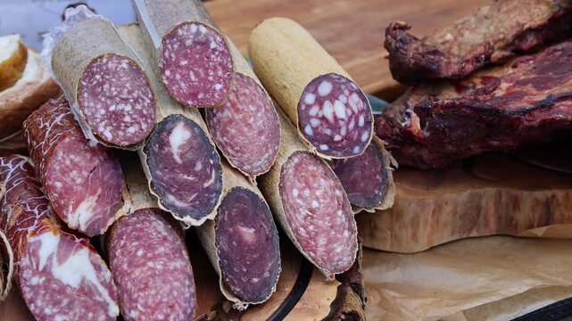 Assortment of Traditional Cured Sausages and Salo. Artisan Charcuterie, Smoked Meat and Pork Delicacies Close Up