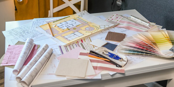 Architectural plans with color palette and fabric samples for eco-friendly interior design, showcasing sustainable architecture, organic materials and biophilic renovation ideas.