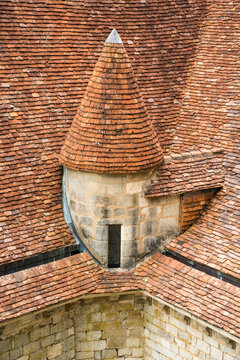 France, Lot, Rocamadour.  Detail of complex roof covered with terracotta tiles. 