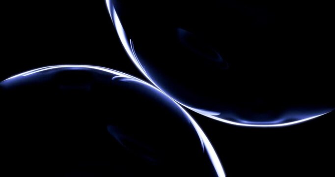 Abstract transparent glass orbs reflecting sweeping blue light waves in dark space