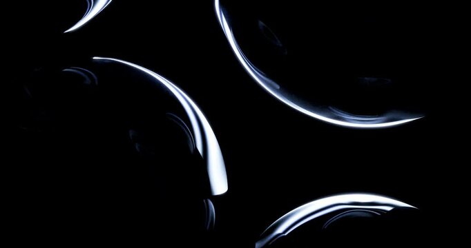 Abstract view of curved transparent glass surfaces with glowing blue edge silhouettes in darkness