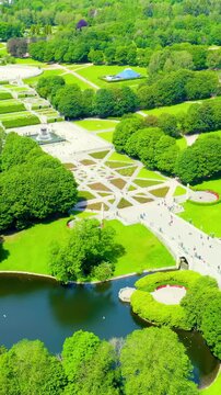 Vertical video. Oslo, Norway. Frogner Public Park with avenue of sculptures under the general name - Vigeland Sculpture Park - Vigelandsparken. Drone footage, Point of interest. Rich colors