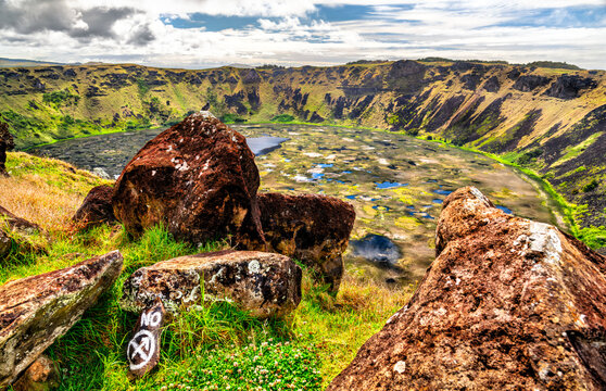 Scenic view looking down into the dramatic Orongo Volcano Crater on Easter Island, Chile, featuring a lush wetland inside the caldera.