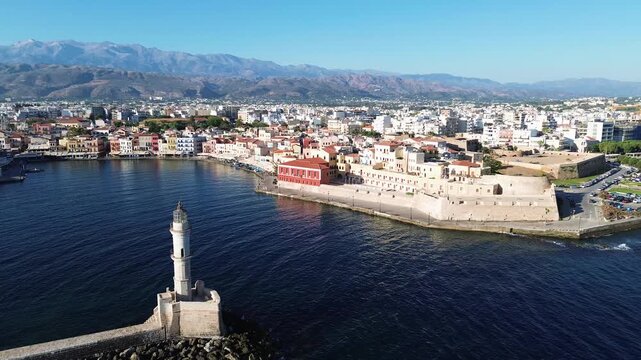 bay of Chania with sea and lighthouse at sunny summer sunset, Crete, Greece,