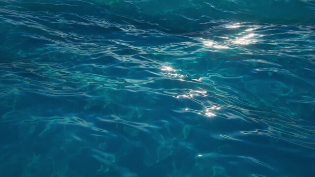 Rolling ocean waves glow with subtle caustic reflections. Seamless loop for marine backgrounds, intros, and digital content. 3d render motion.