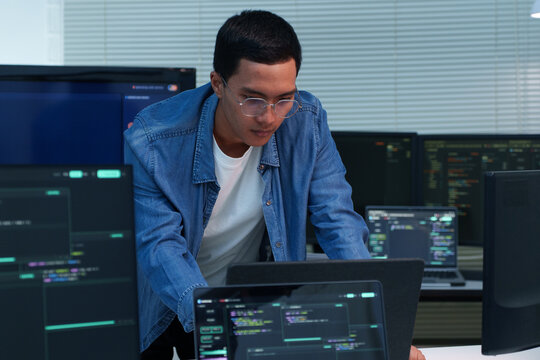 Programmer Working on Software Development and Digital Code