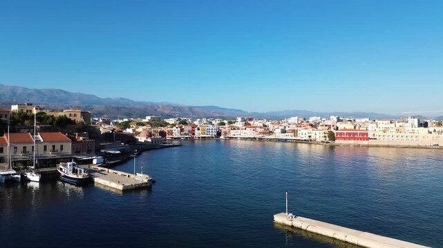 bay of Chania with sea and lighthouse at sunny summer sunset, Crete, Greece,
