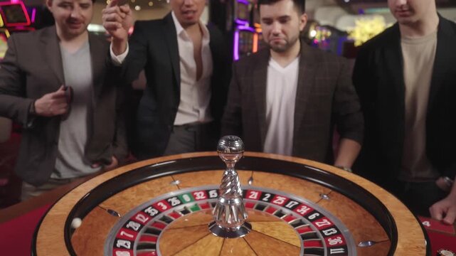 Long take close-up of dice being thrown onto a roulette table with red and black betting areas in a casino. Cinematic casino gambling atmosphere, close-up detail, rolling dice, roulette table, gaming