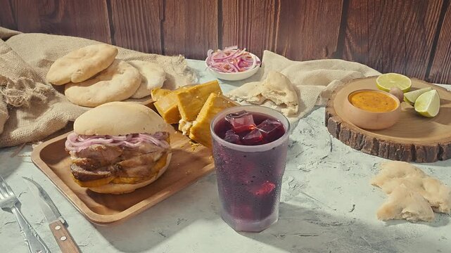 Peruvian breakfast, Chicha Morada alongside a Peruvian Pan con Chicharr&oacute;n Combo