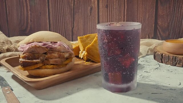 Peruvian breakfast, Chicha Morada alongside a Peruvian Pan con Chicharr&oacute;n Combo