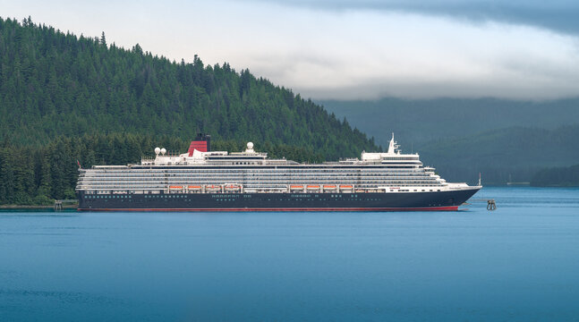 Alaska, United States - July 15, 2026: Side View of Cunard Queen Elizabeth Cruise Ship Anchored at Icy Strait Point, Alaska