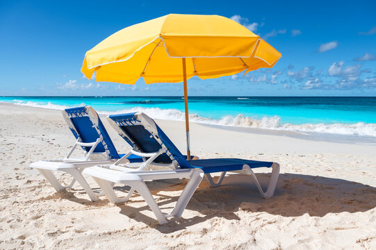 Two Lounge Chairs and Yellow Umbrella on Shoal Bay Beach, Anguilla