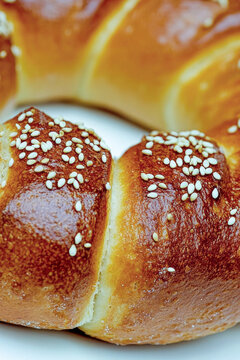Close-up shot of a sesame seed bun, perfect for food or bakery use. vertical frame