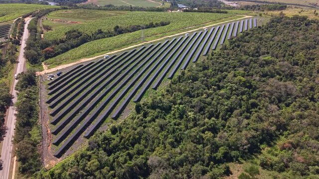 Aerial view of a solar energy farm in the countryside