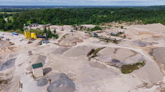 oncrete silos and aggregate piles show a major construction materials facility