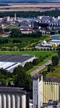 Drone aerial portrait of phosphate fertiliser manufacturing buildings and production factory plants within a rural town suburbs in Kėdainiai Lithuania Europe infrastructure and chemical industry