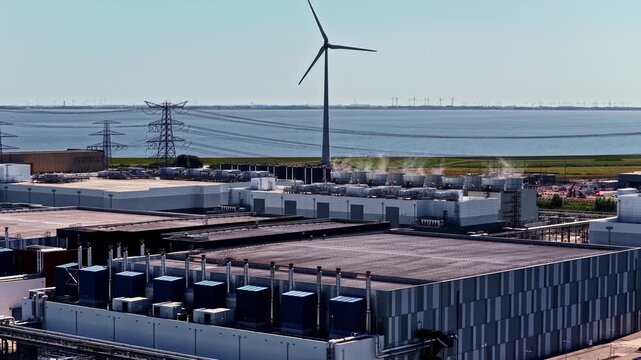 Google GRQ Data Center Surrounded by Wind Turbines in Eemshaven, Netherlands - Pan Right Shot