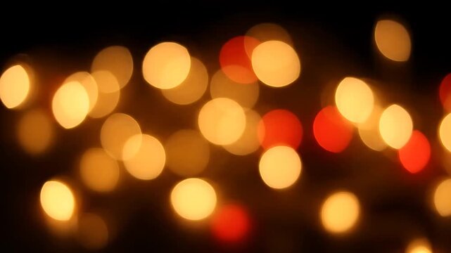 Golden Bokeh Lights Gently Fading in and Out Against a Black Background, Creating a Soft, Warm, Looping Animation.