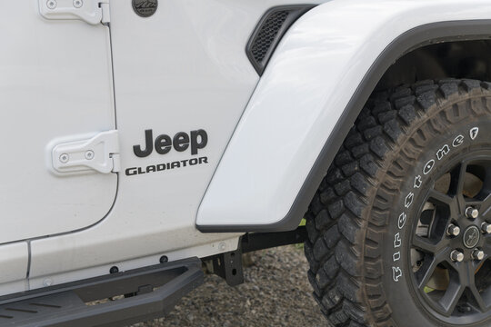 Firestone tire and Jeep Gladiator model badge on the side of a vehicle in Toronto